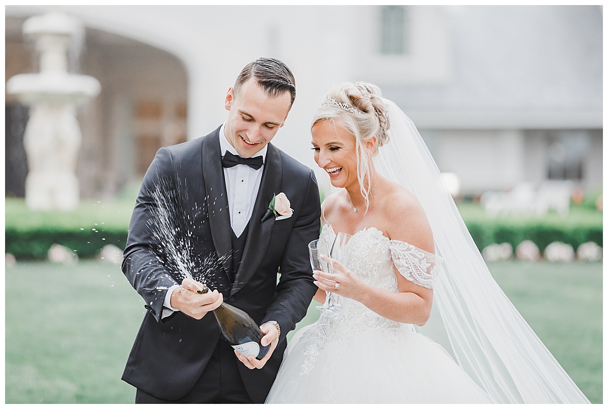 Park Chateau Estate Wedding Champagne Pop with Bride and Groom 