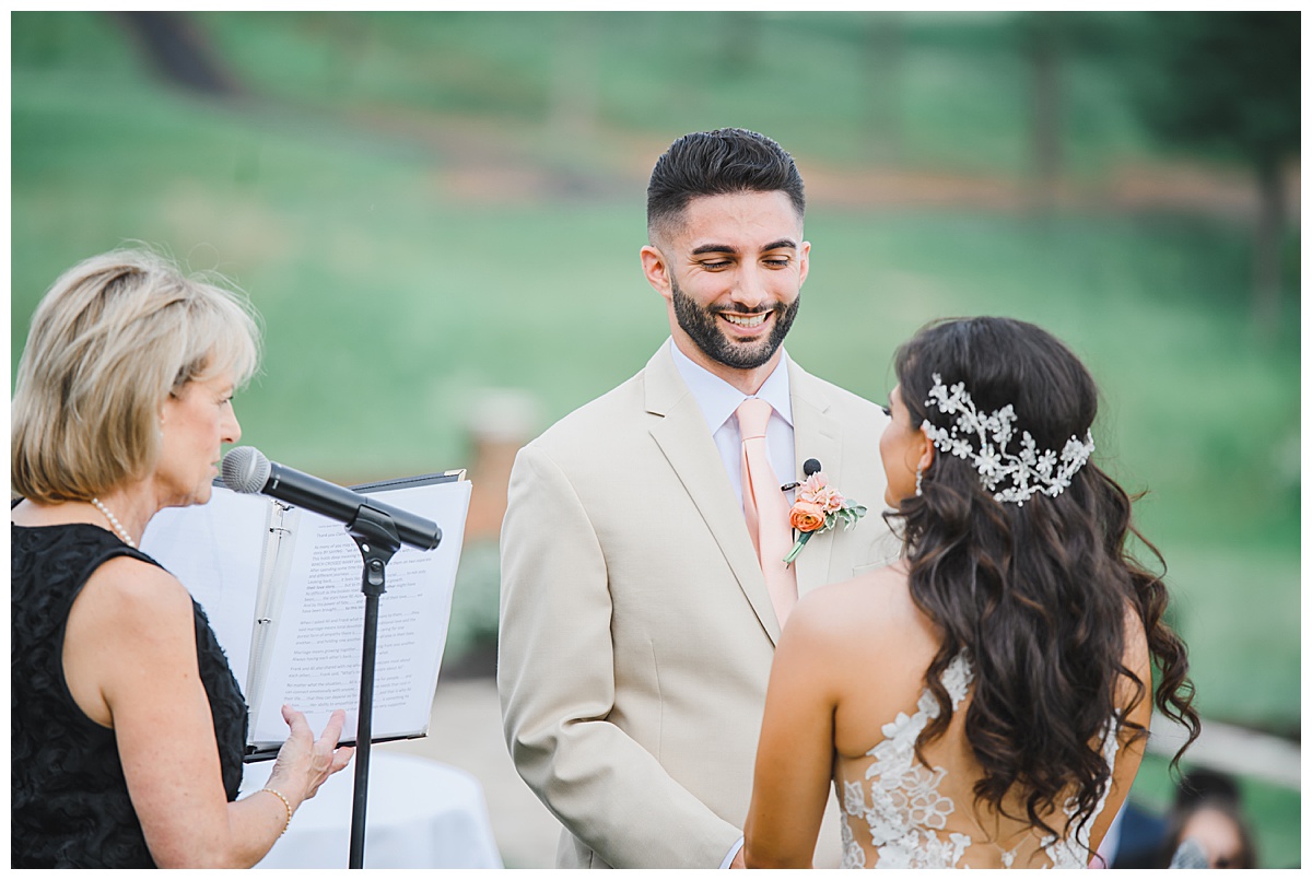 groom laughing during wedding ceremony 
