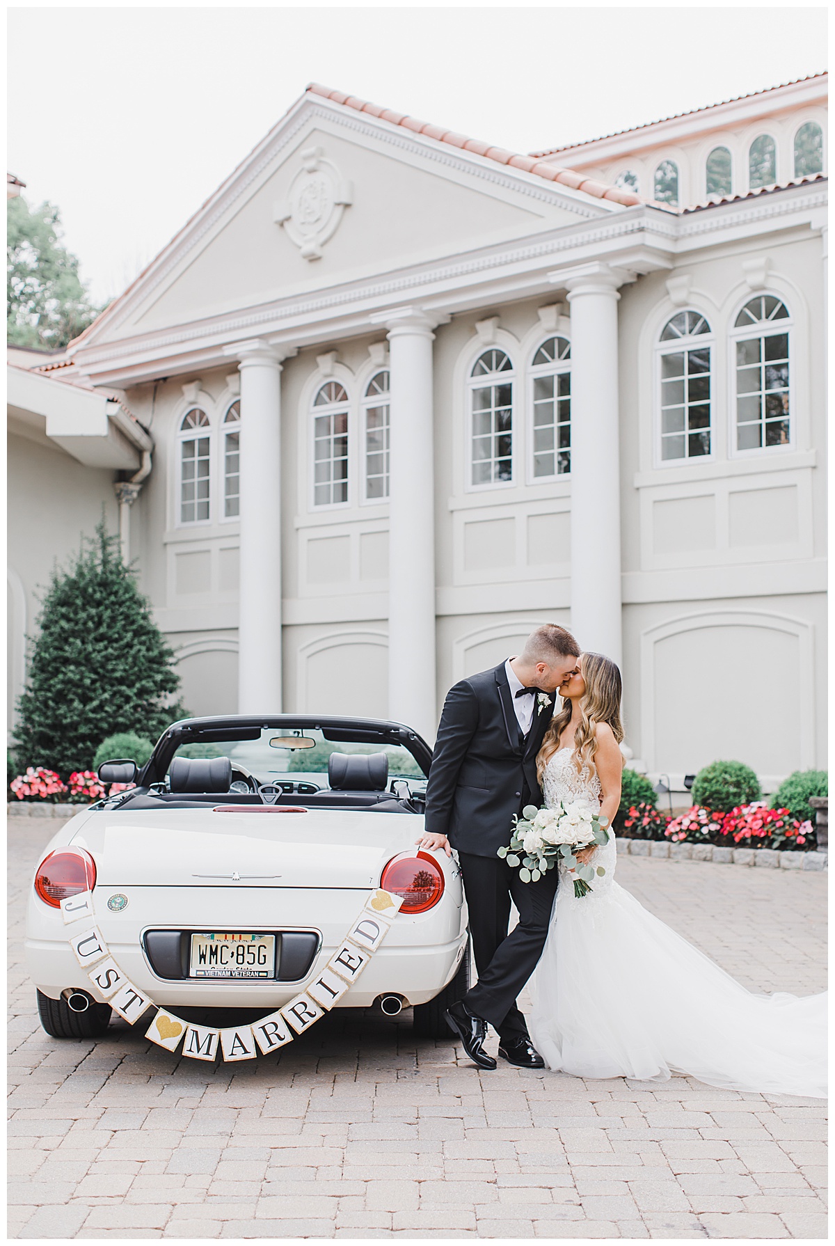 bride and groom with car and just married sign 