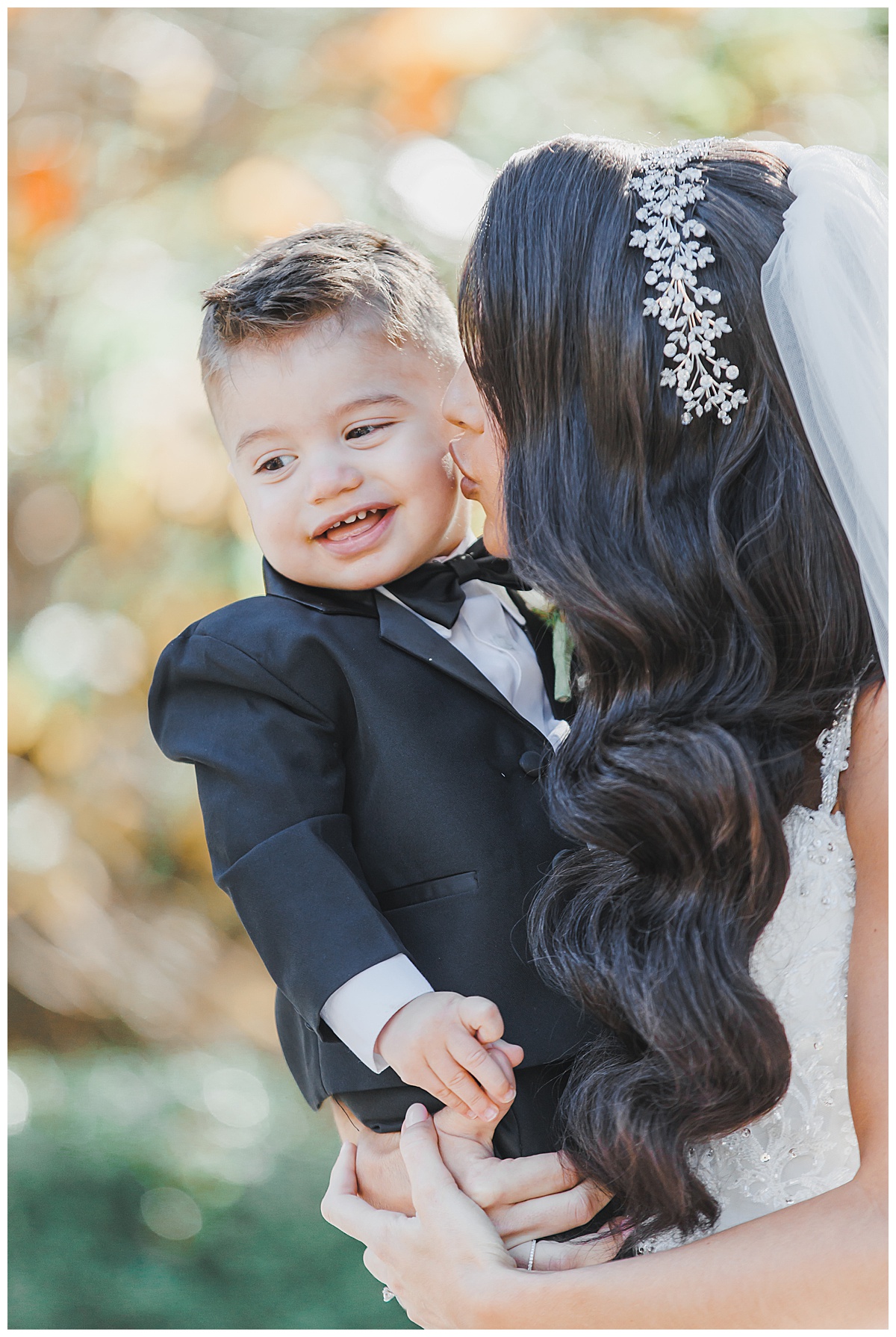 bride with son on wedding day 