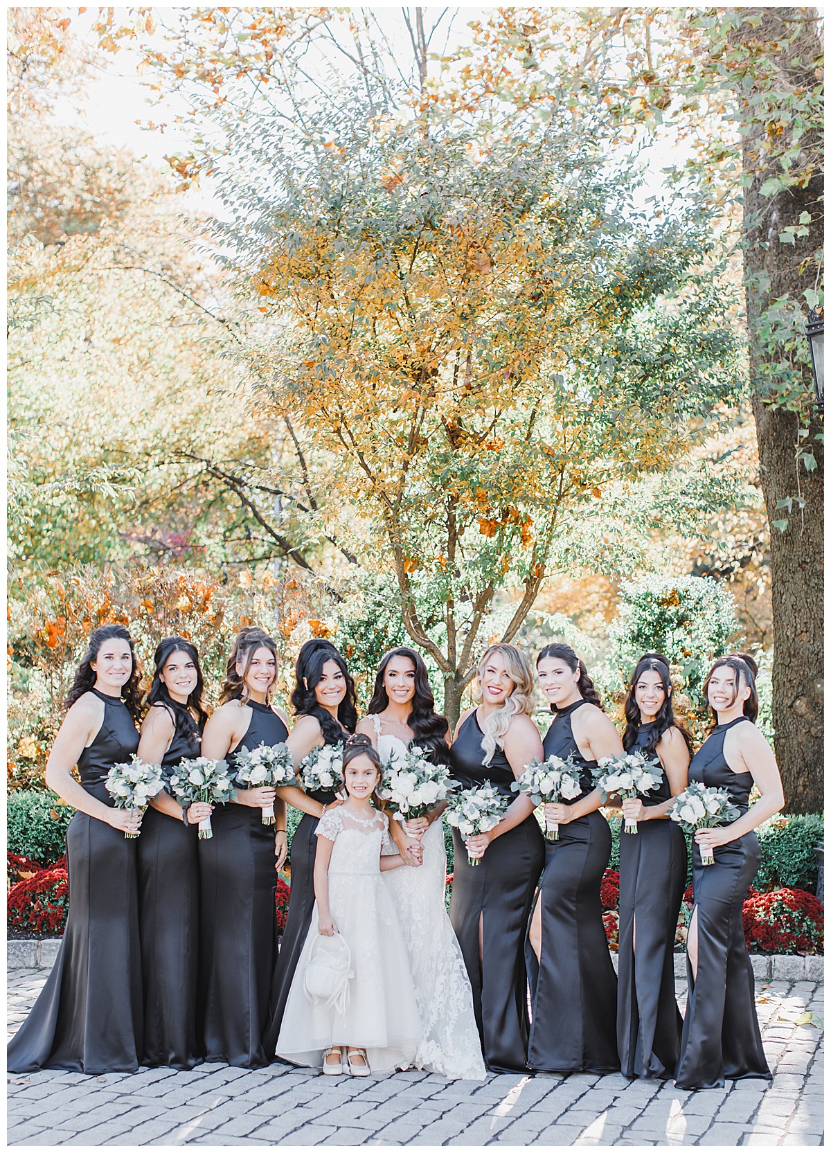 bridesmaids at naninas in the park wearing black gowns 
