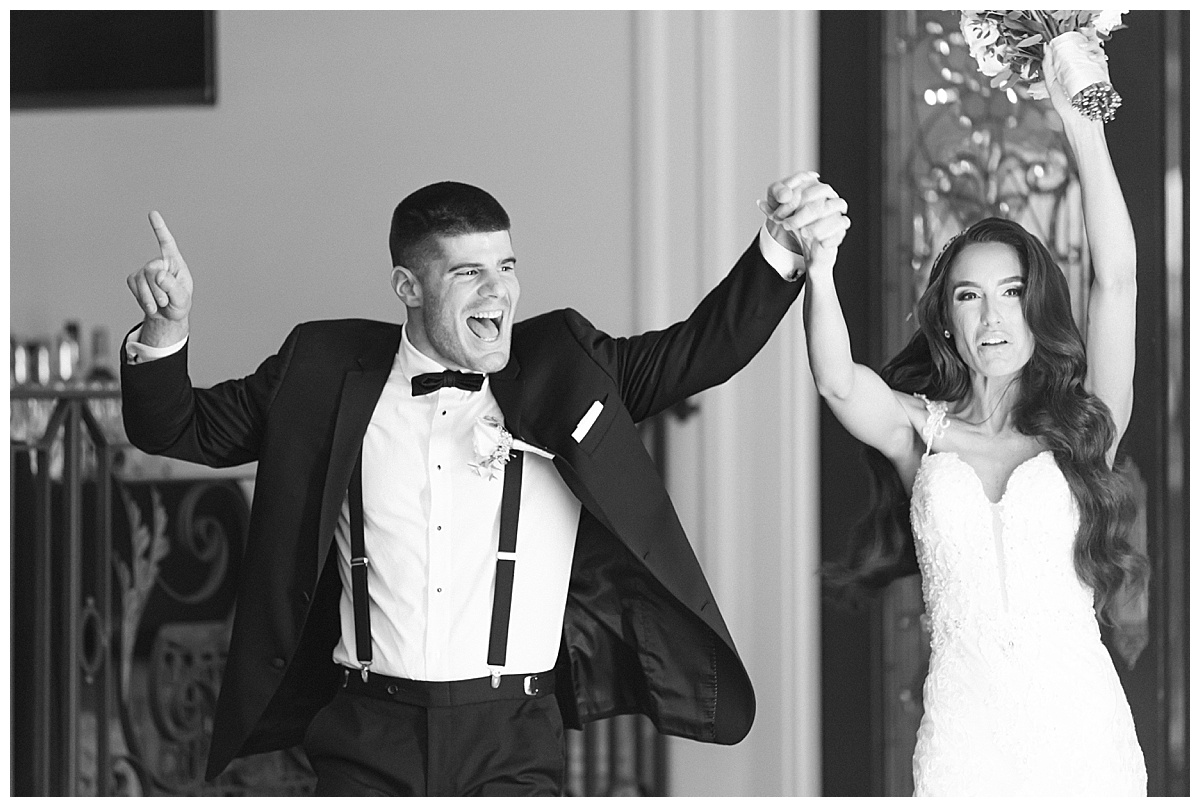 bride and groom entering ballroom 