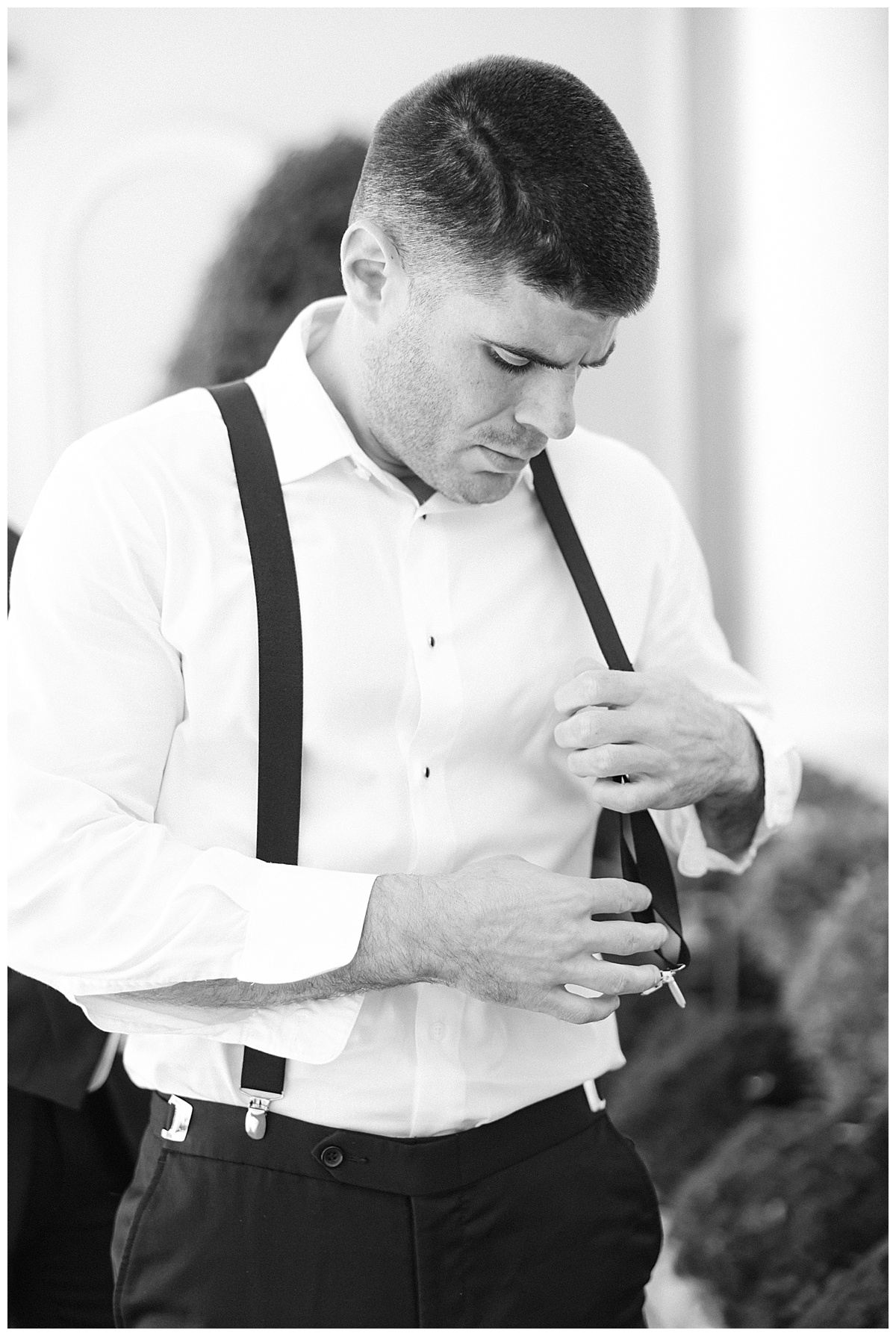 groom outside naninas black and white 