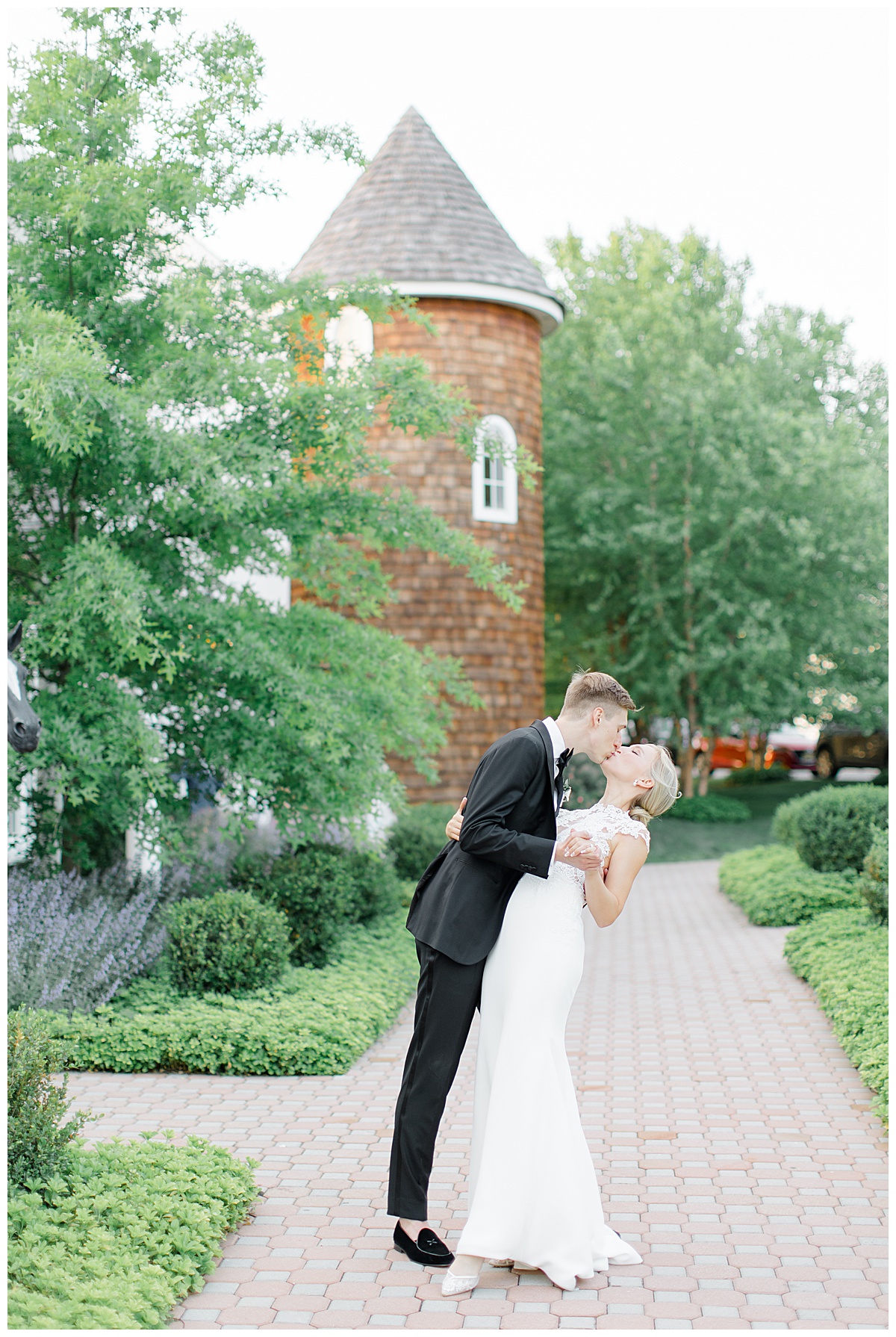 groom dipping bride in front of silo at Ryland inn 