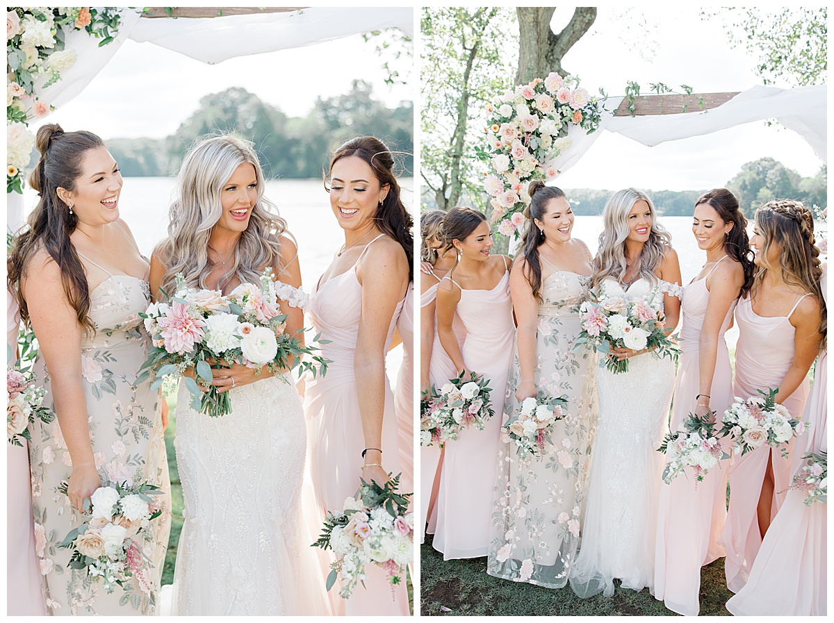 bridesmaids In blush with lake behind them 