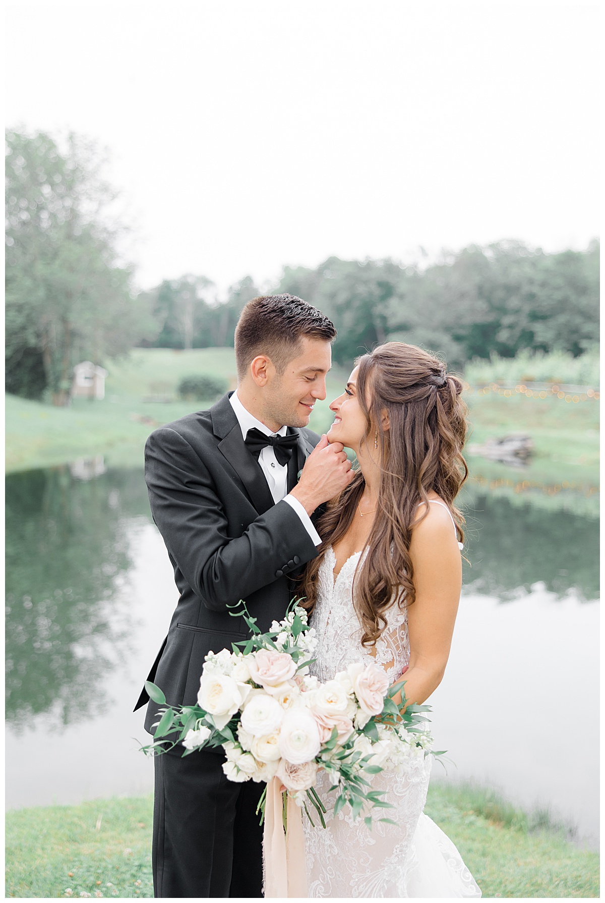 bride and groom on lake 