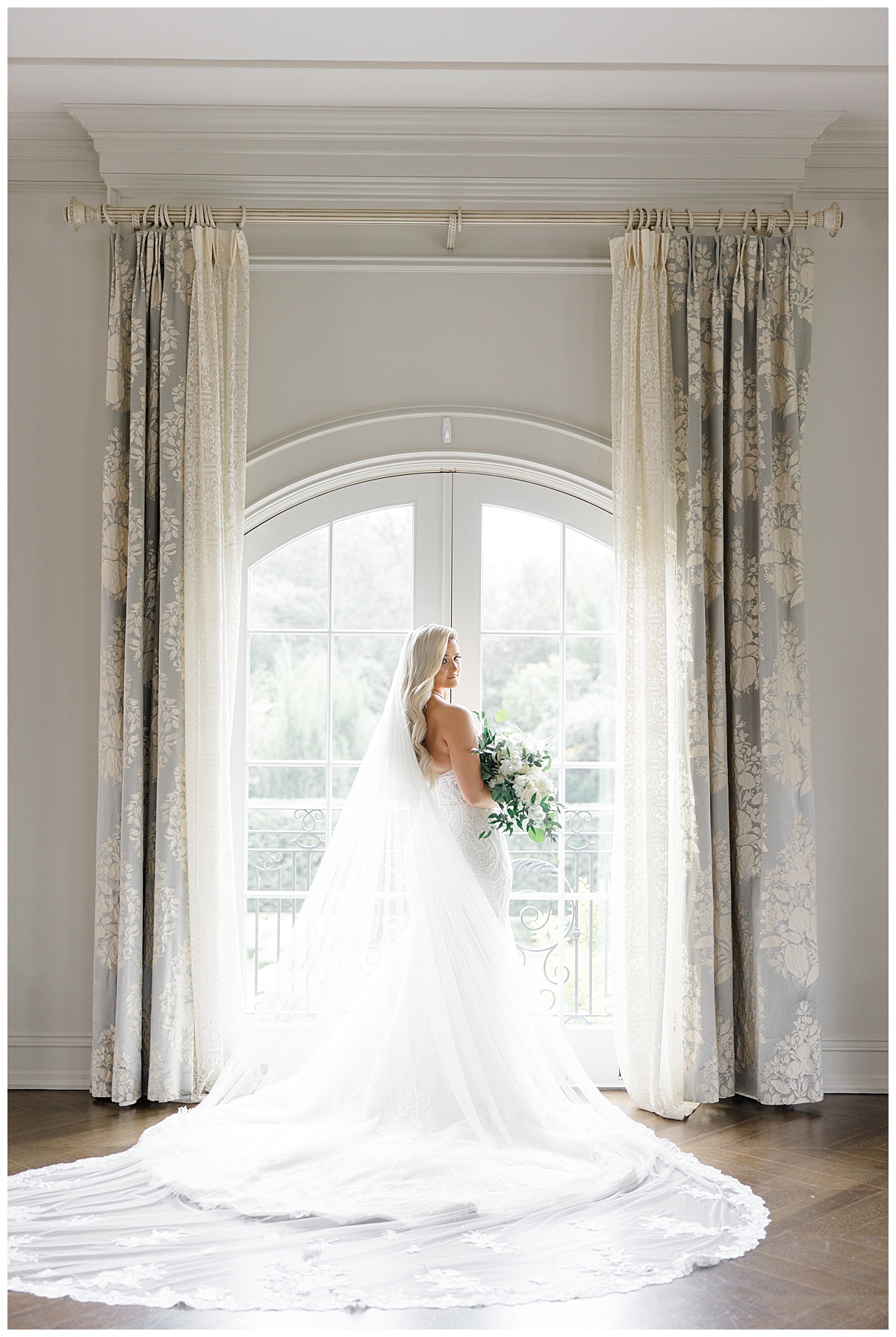 bride looking out window of bridal suite at park chateau 