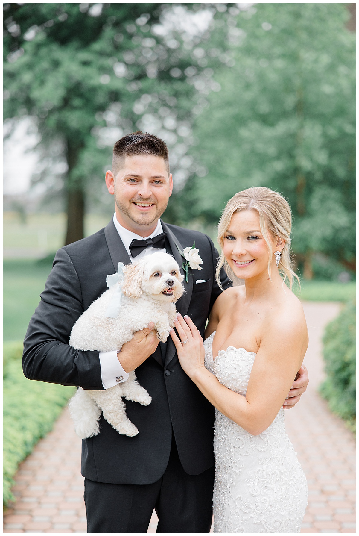 Bride and From with dog on wedding day 