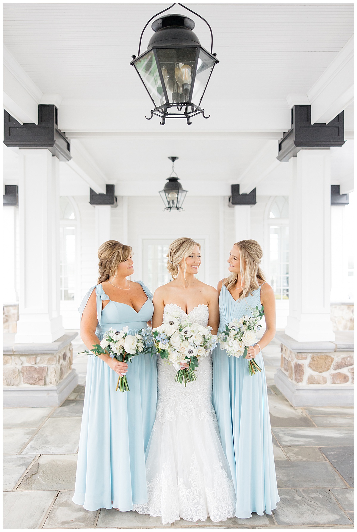 Bride with bridesmaids in light blue dresses 