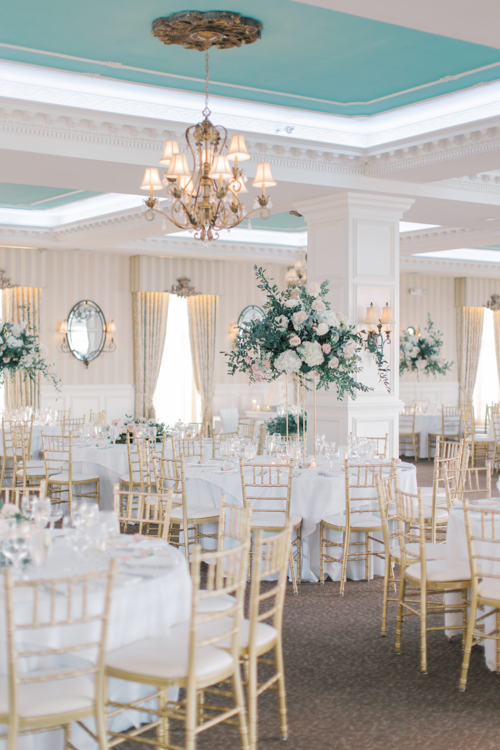 Reception details in the ballroom with Tiffany blue ceiling at Mallard Island Yacht Club. 
