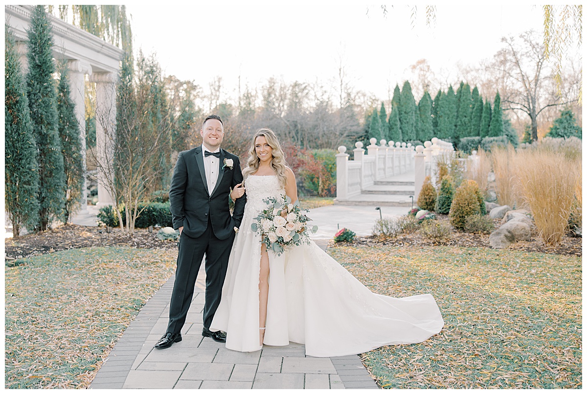 bride and groom smiling together during fall wedding at the mansion on Main Street 