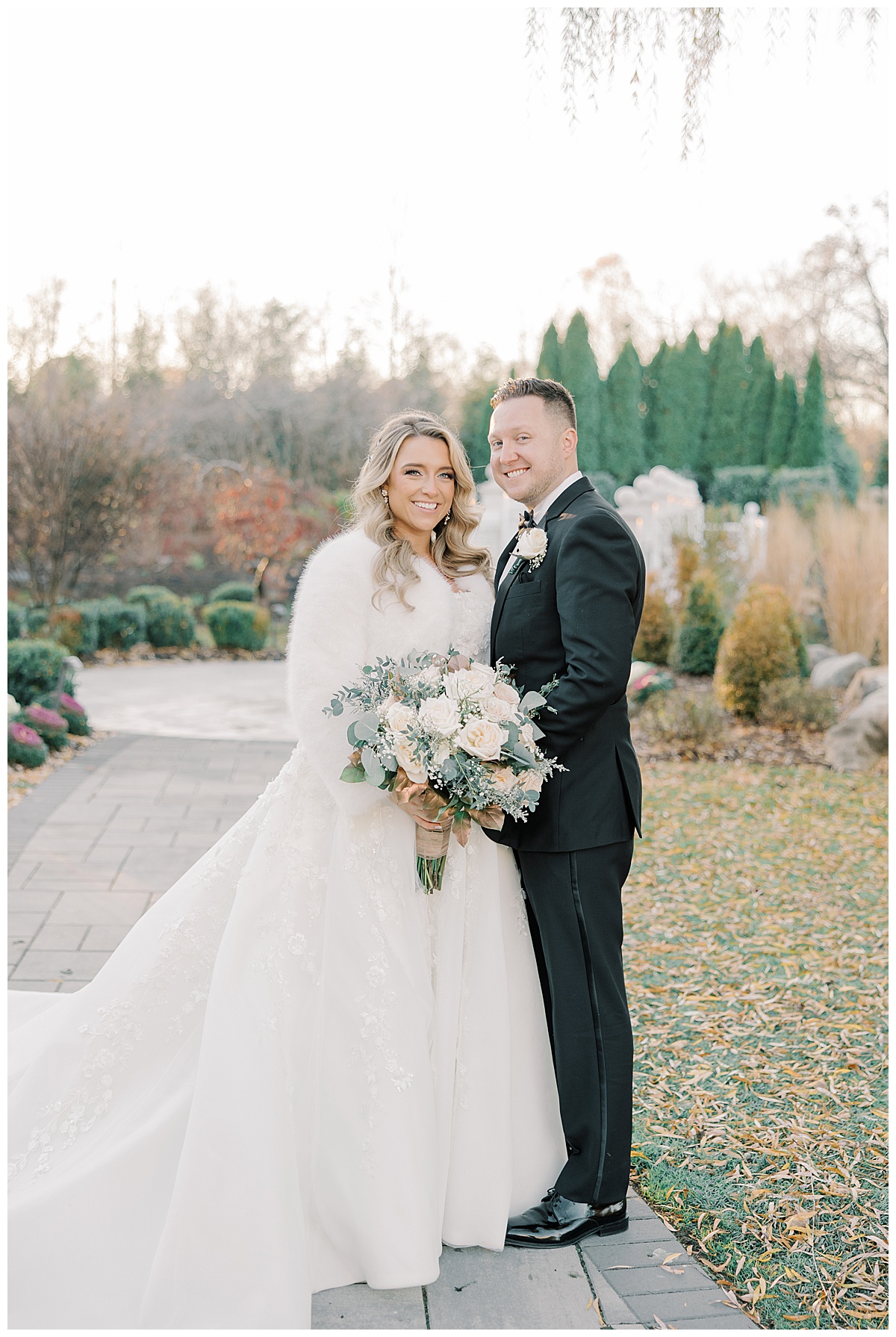 bride and groom smiling during winter wedding light and airy photos 