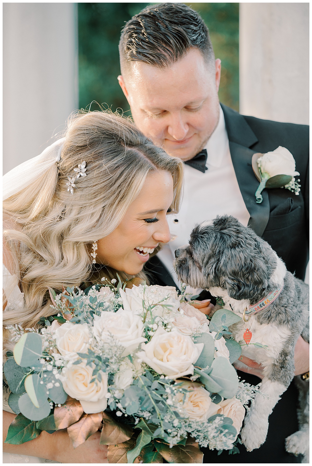 bride and groom with dog on wedding day at the mansion on Main Street in vorhees nj 