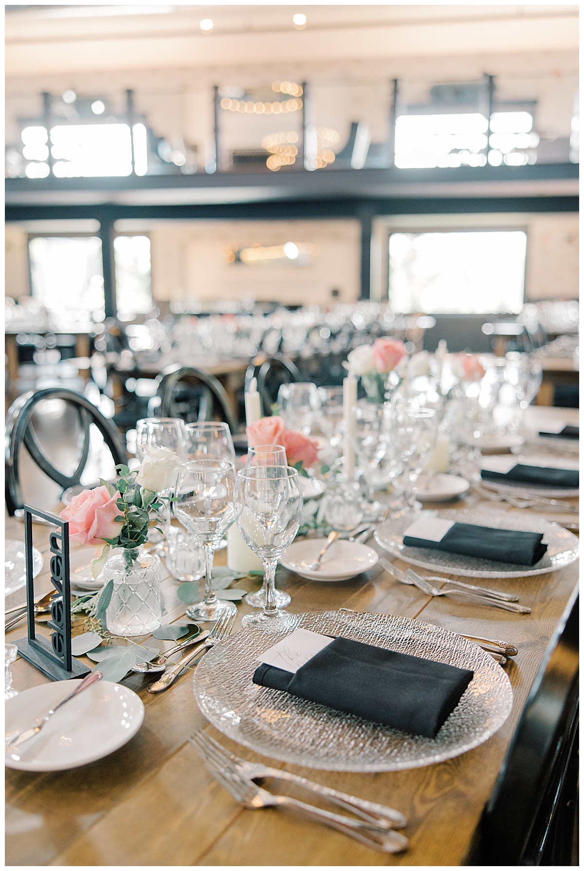 clear glass chargers with black napkins on wedding day 
