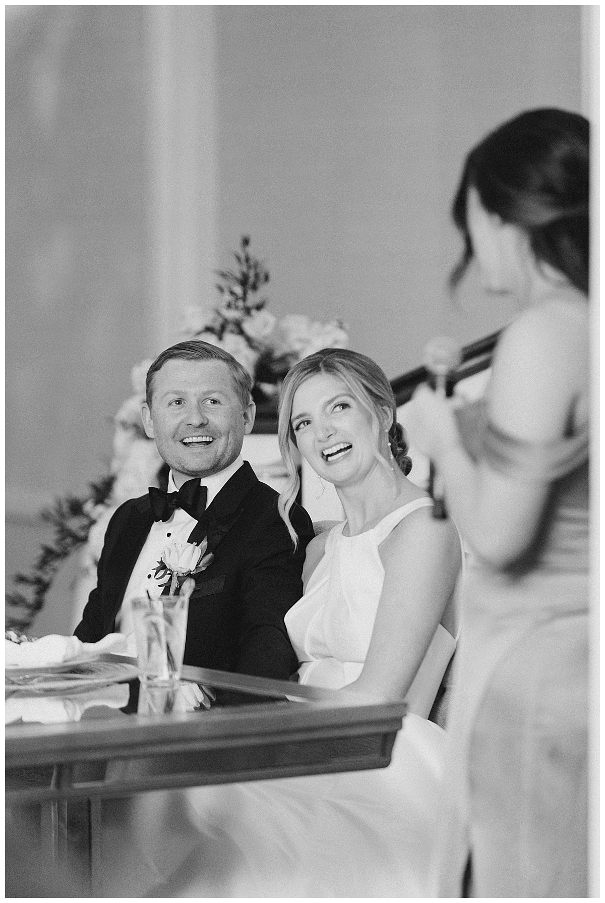 Bride and groom laugh at Maid of Honor as she gives heartfelt speech on wedding day at The Mill Lakeside Manor. 