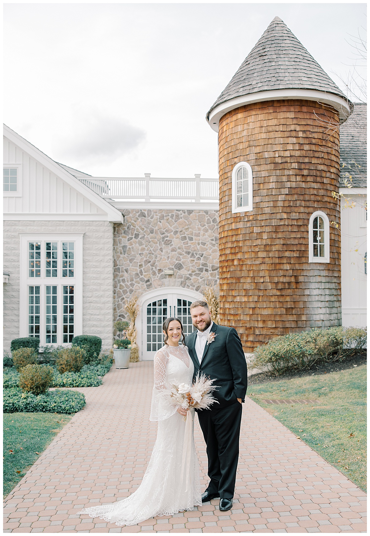 Bride and groom in front of silo at The Ryland Inn in Whitehouse Station.