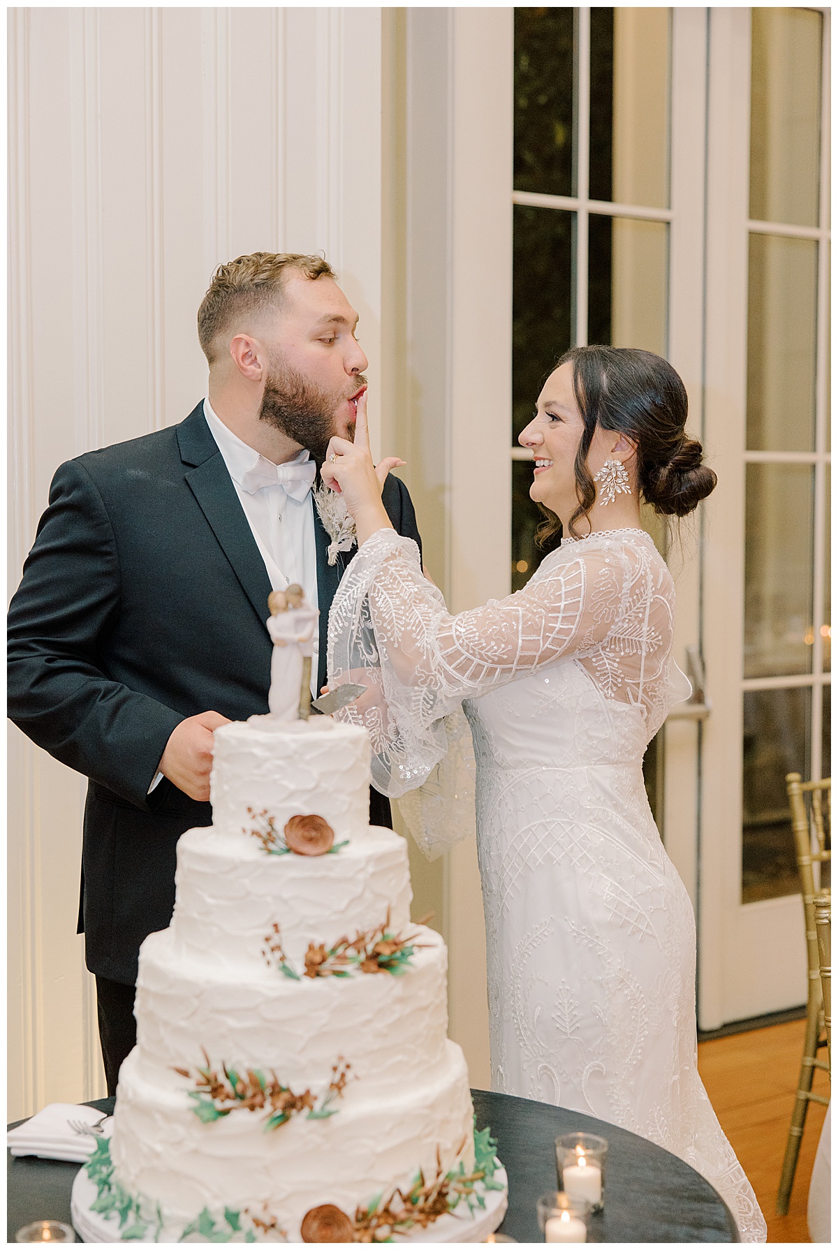 Bride feeds groom wedding cake at The Ryland Inn in Whitehouse Station. 
