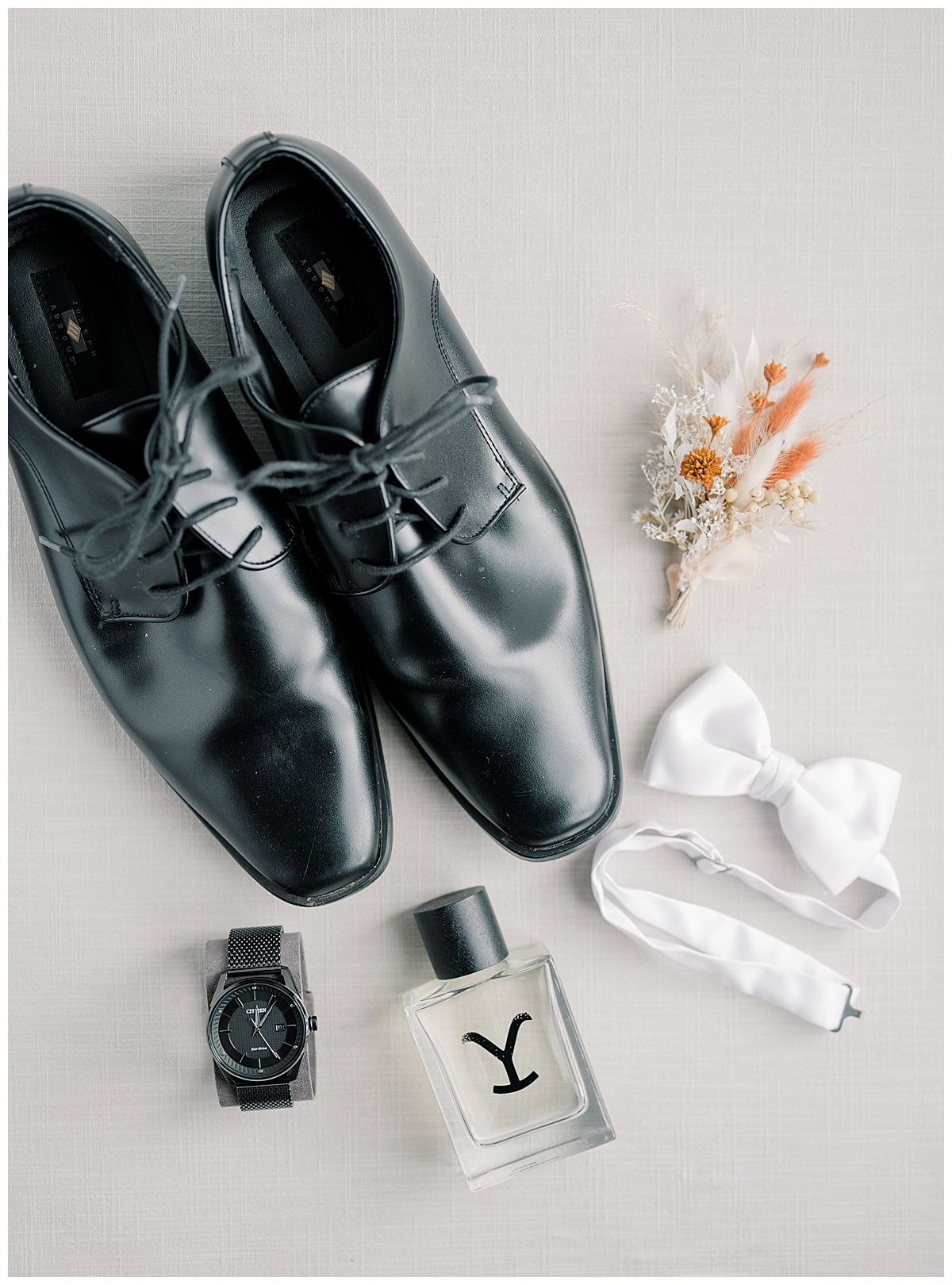 Black tuxedo shoes and groom details on wedding day. 