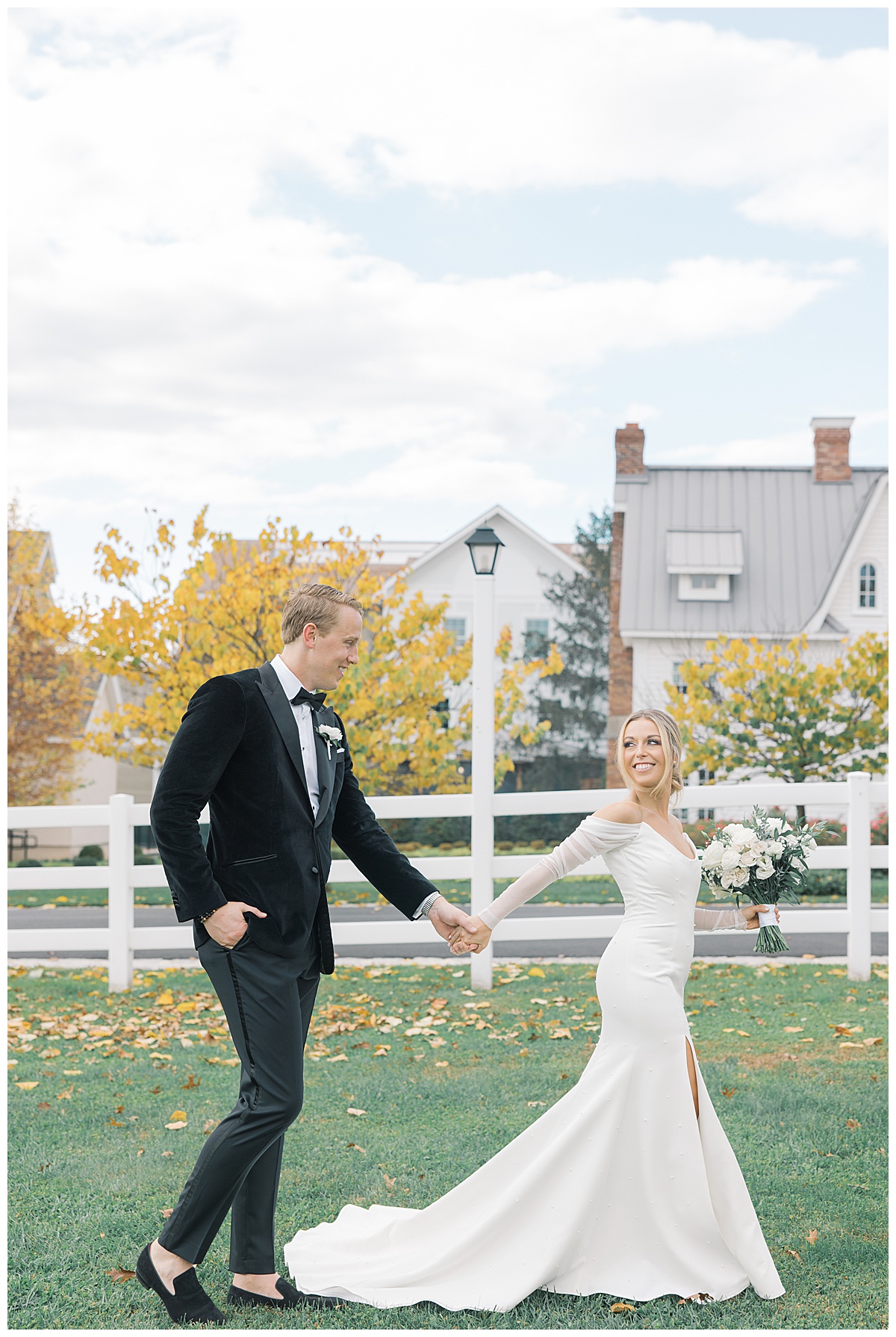 Bride leading groom in field during the fall at The Ryland Inn. 