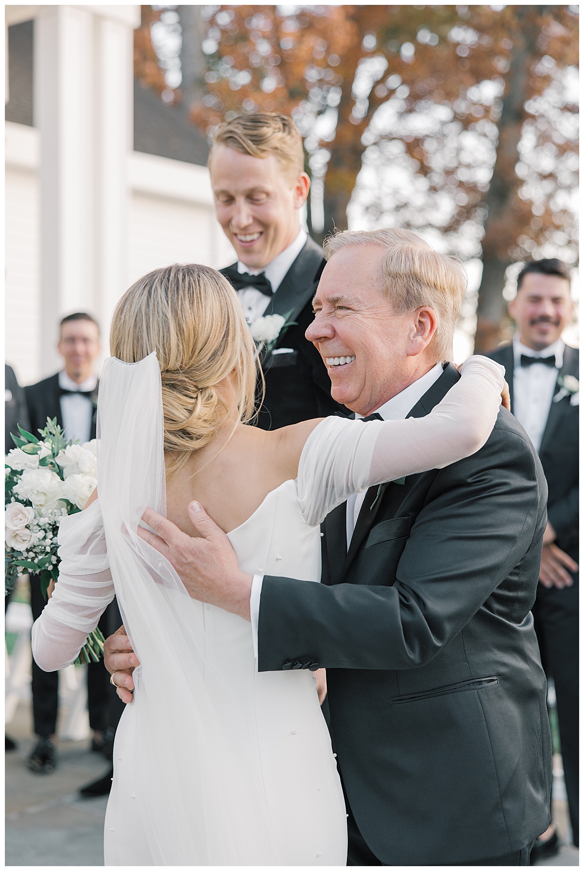 Dad gives bride a big hug as he hands her off at The Ryland Inn. 
