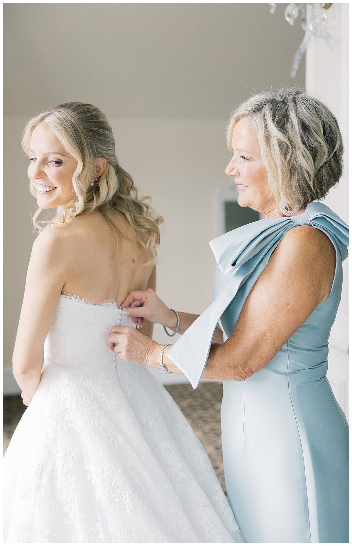 Mom zipping up daughters wedding dress at Trump National Bedminster 
