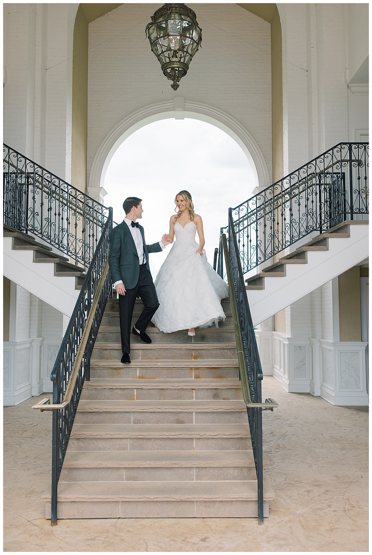 groom leading bride down the stairs at Trump National Golf Bedminster
