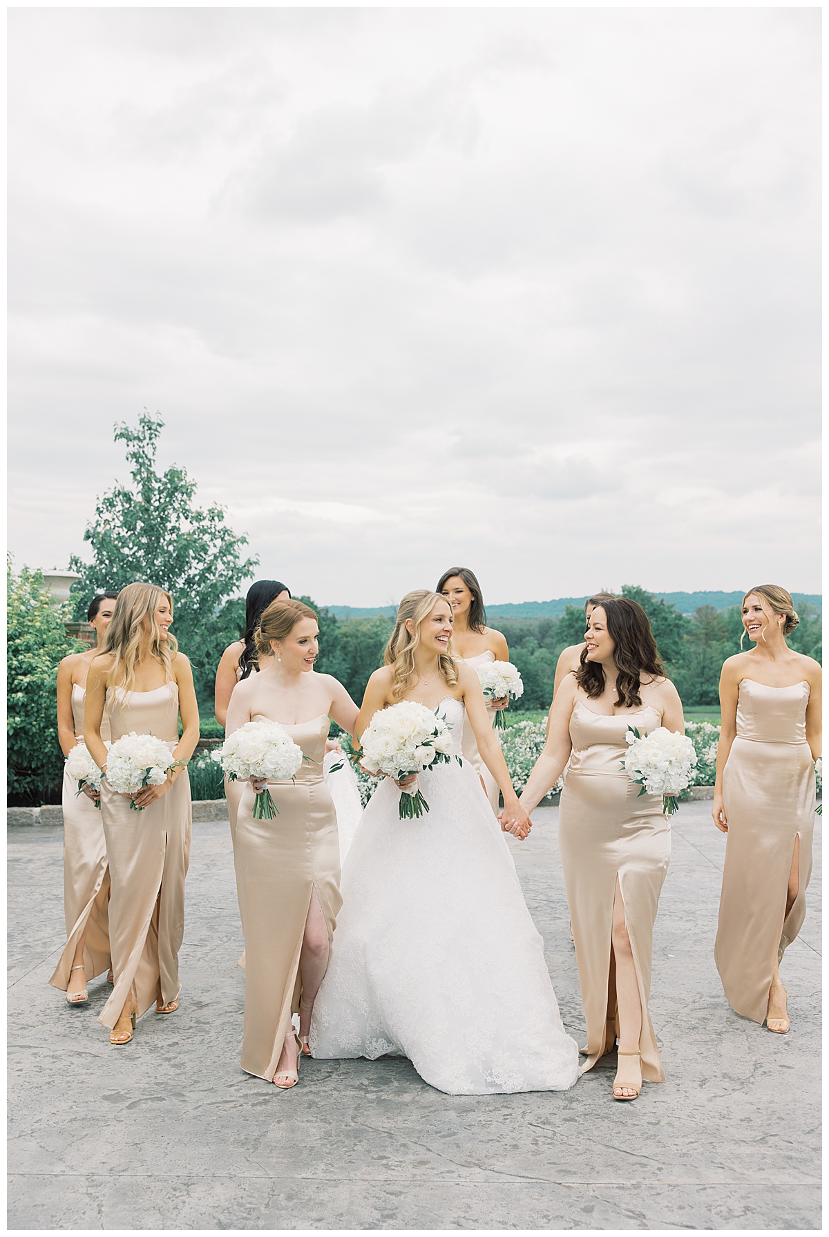 bride walking with her girls on her wedding day in champagne satin wedding dresses 