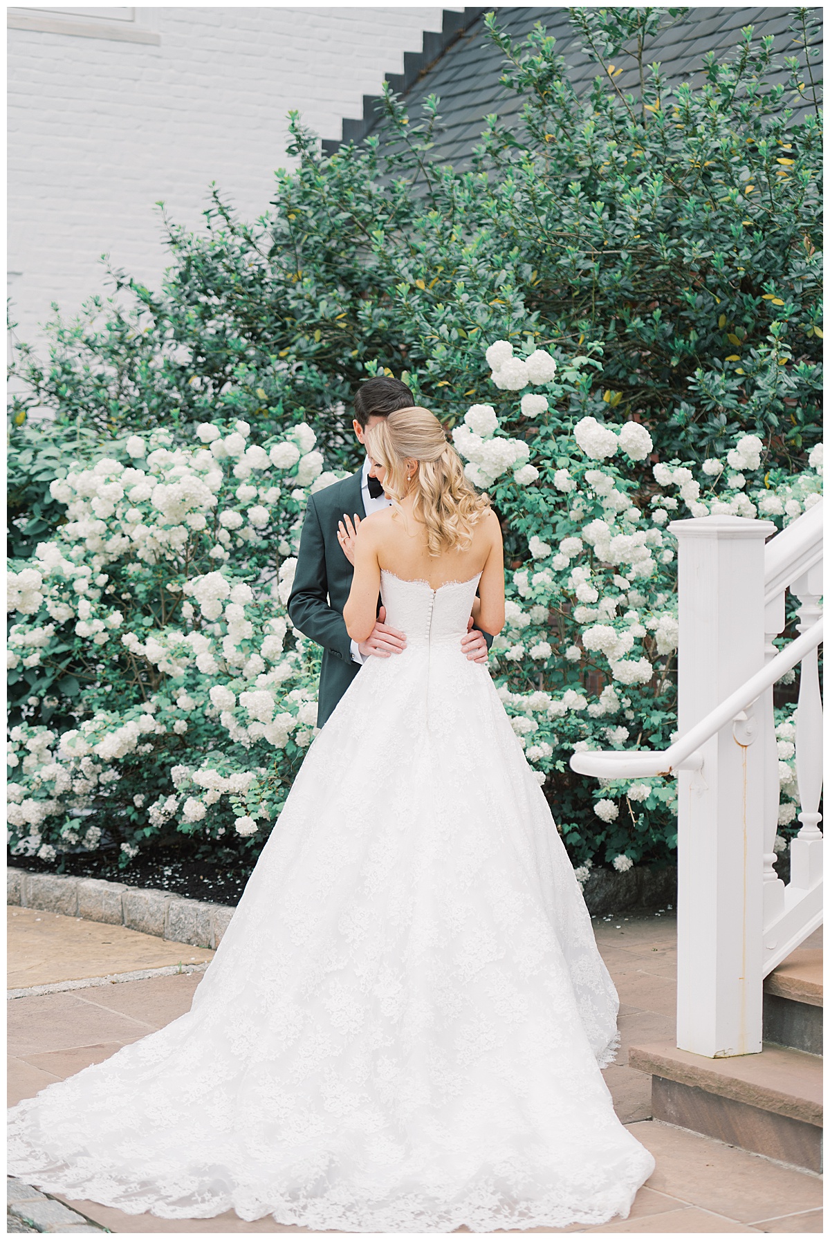 bride and groom in front of beautiful hydrangeas 