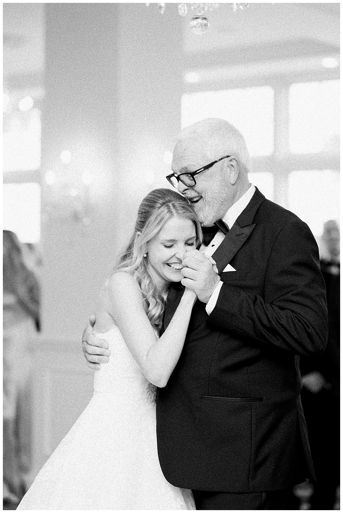 Bride and dad dance together and share sweet moment laughing 