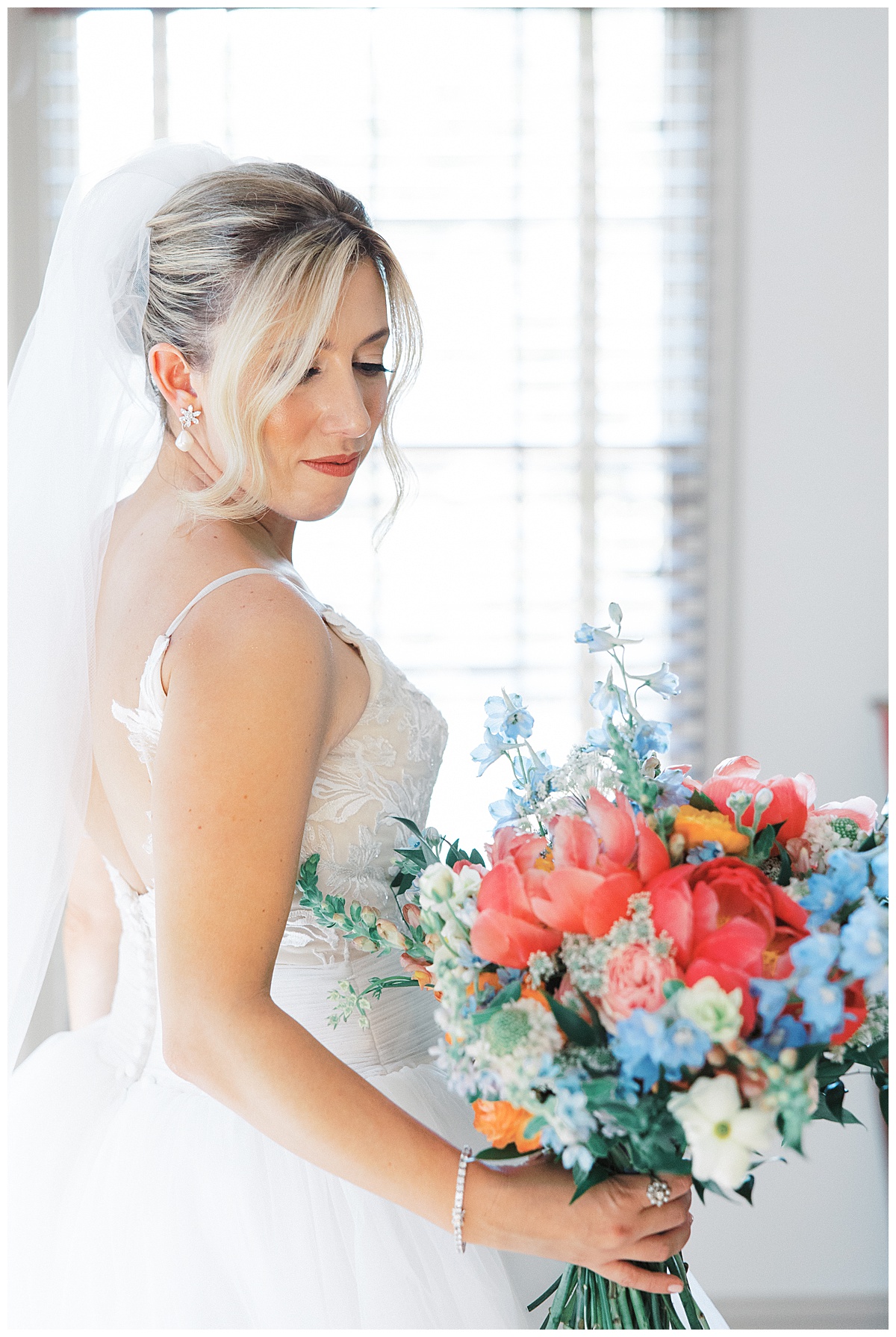 Bride with colorful wildflower bouquet. 