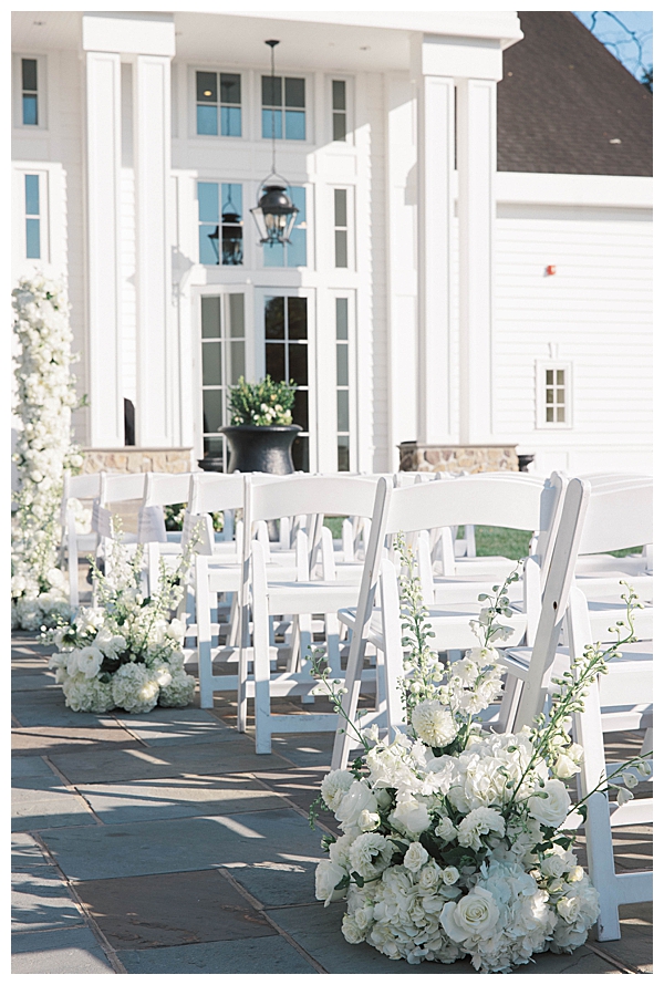 Ryland Inn NJ wedding ceremony with white florals