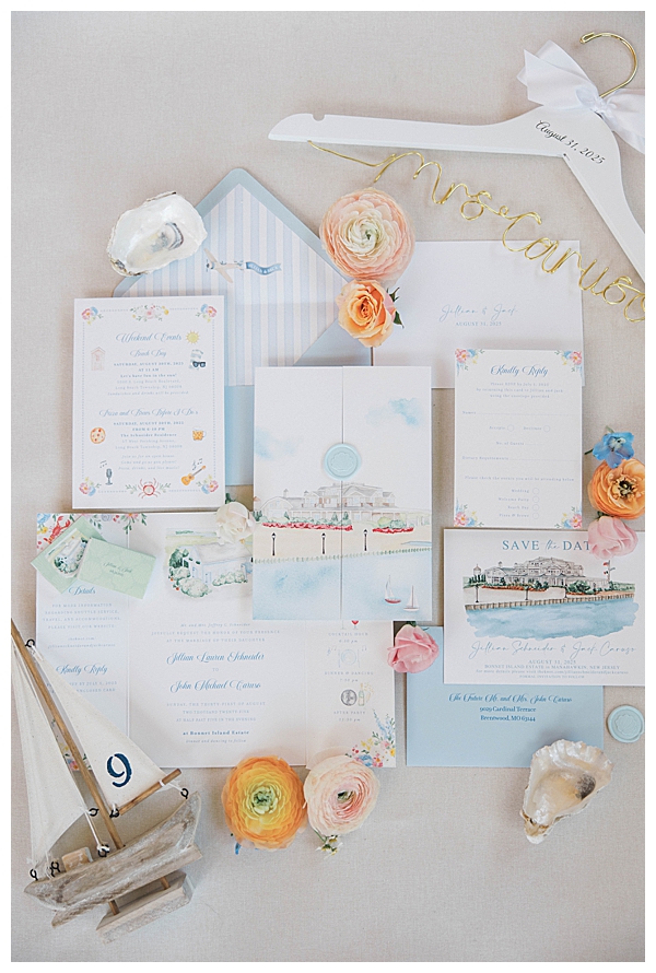 Wedding invitation suite with blue and pink coastal design
