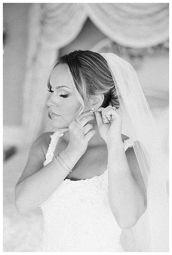 Emotional bridal getting ready moment with bridesmaids in blue tones