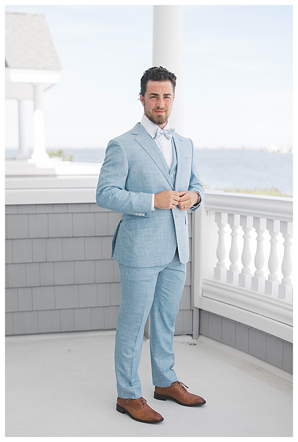 Groom details with boutonniere at Nantucket-inspired wedding