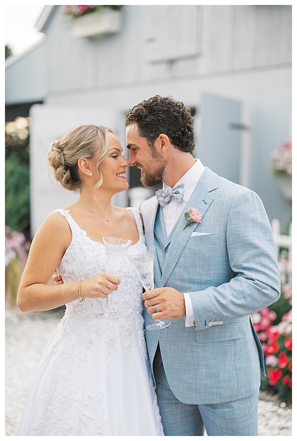 Bride and groom walking by the water at Bonnet Island Estate