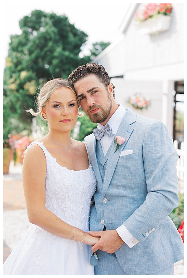 Romantic seaside wedding portraits with soft pastel colors