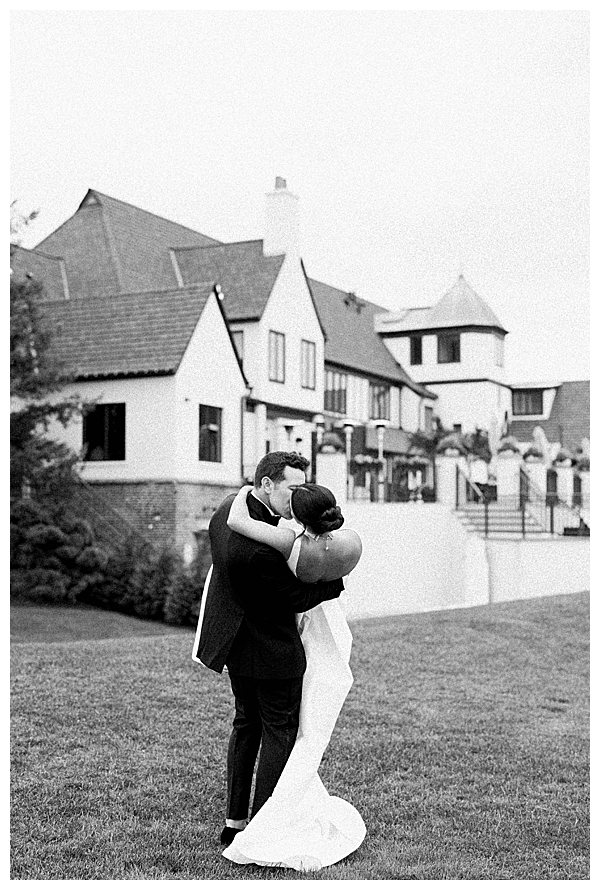 Bride and groom walking together on the golf course at their black tie NJ wedding