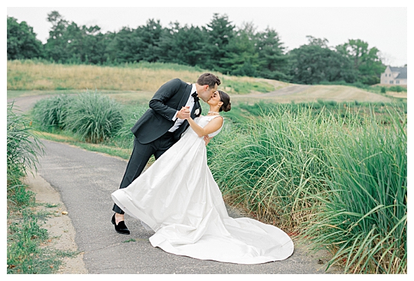 Romantic portrait of the bride and groom surrounded by lush greenery