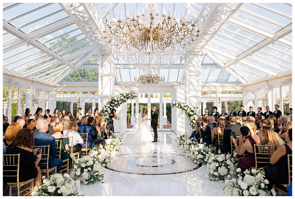 Close-up of the bride and groom exchanging heartfelt vows during their outdoor ceremony at a New Jersey wedding