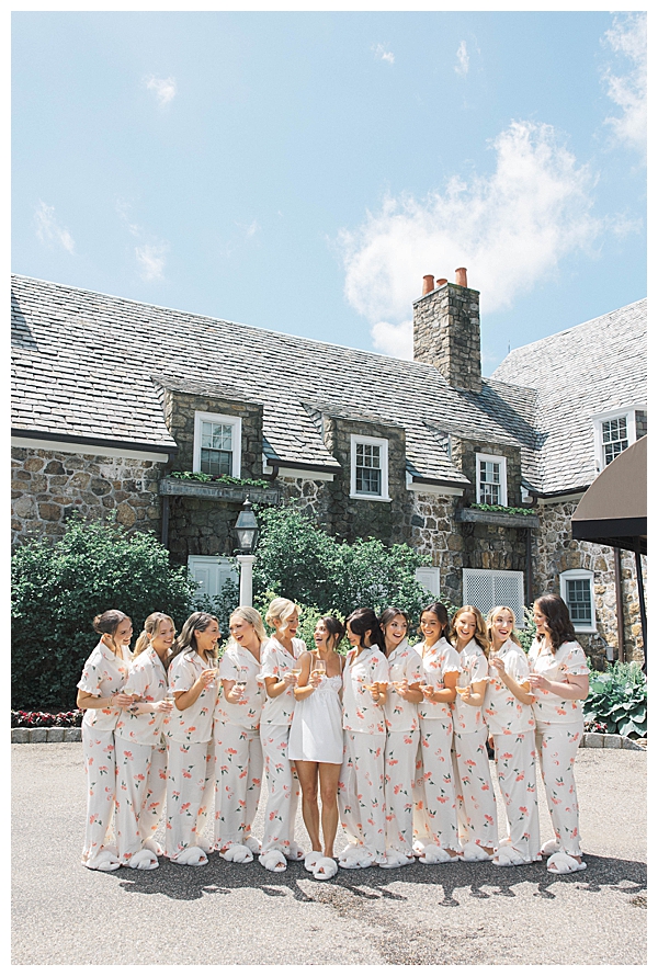 bridesmaids popping champagne