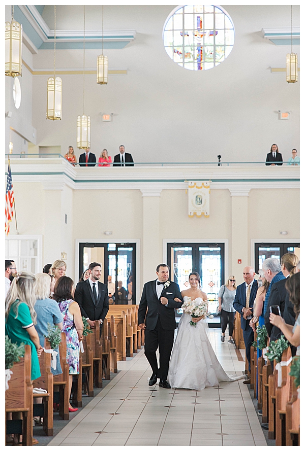 bride walking down aisle in church
