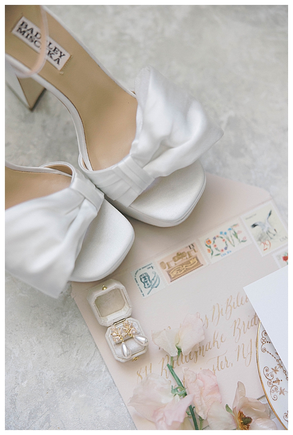 Blush ribbon styled with Sarah + Griffin wedding invitation