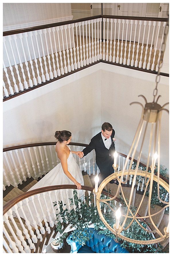 bride and groom walking down stairs