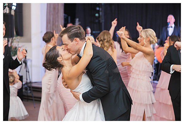 Groom celebrating on dance floor at Fiddler’s Elbow wedding