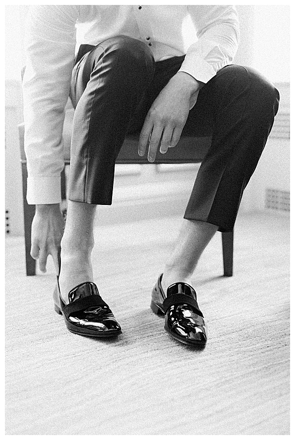groom putting on shoes