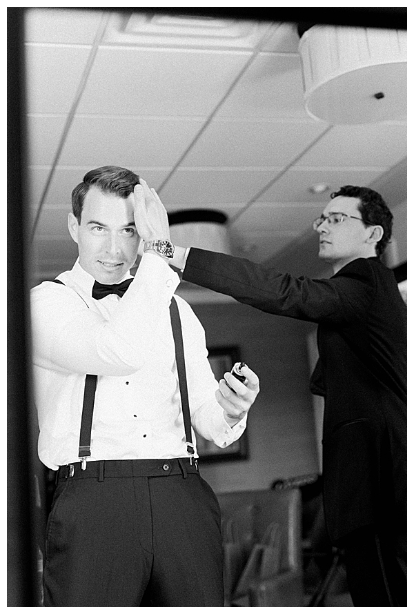 groom looking in mirror