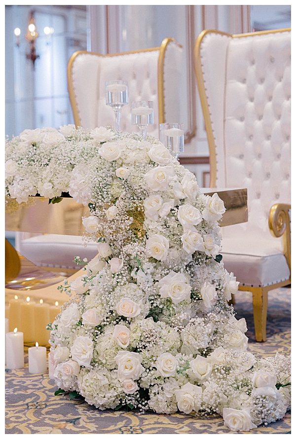 Floral arrangements on chapel pews at Legacy Castle wedding ceremony New Jersey