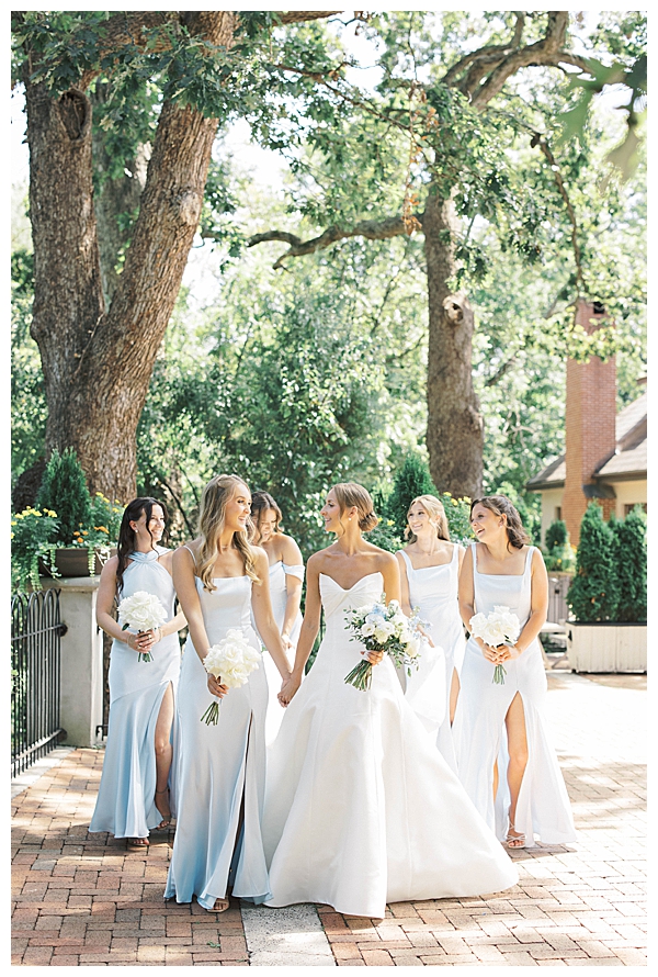 bridesmaids in dusty blue dresses wedding day
