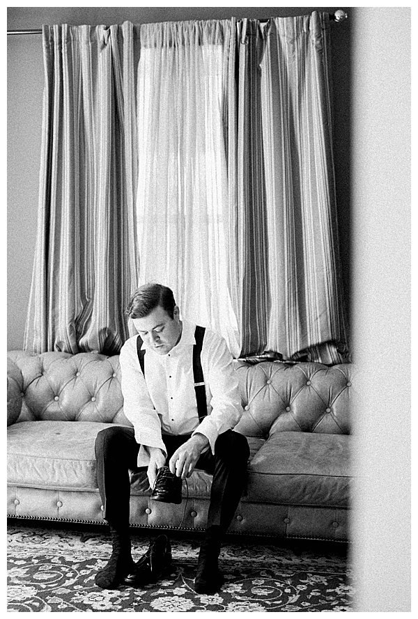 groom putting on shoes