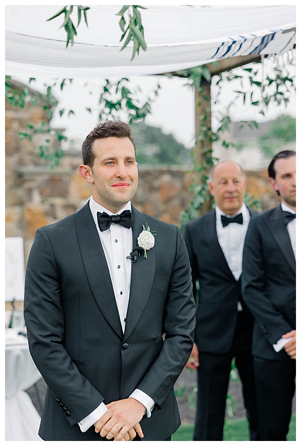 Groom's emotional reaction as Hannah walks down the aisle toward him